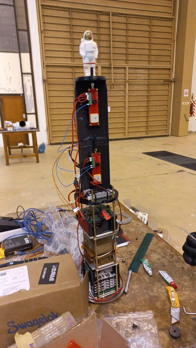 Tall avionics stack with an astronaut figurine on top